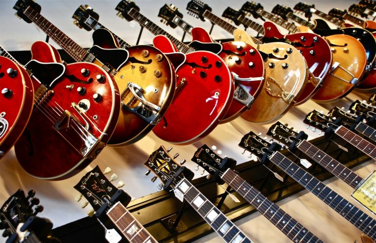 Guitars hanging on the wall - Music Store Signs post